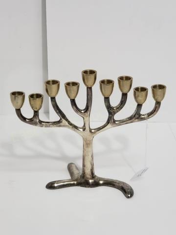 Modern Silver Plated Hanukah Menorah 9 Lights: 8.25" tall. 10.25" wide. Unmarked. With brass candle cups on silver plated arms.