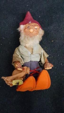 A Small AS IS Steiff Gnome 713,1 GUCKI: The gnome is 5" tall. Significant wear to the hands and head. Label intact.