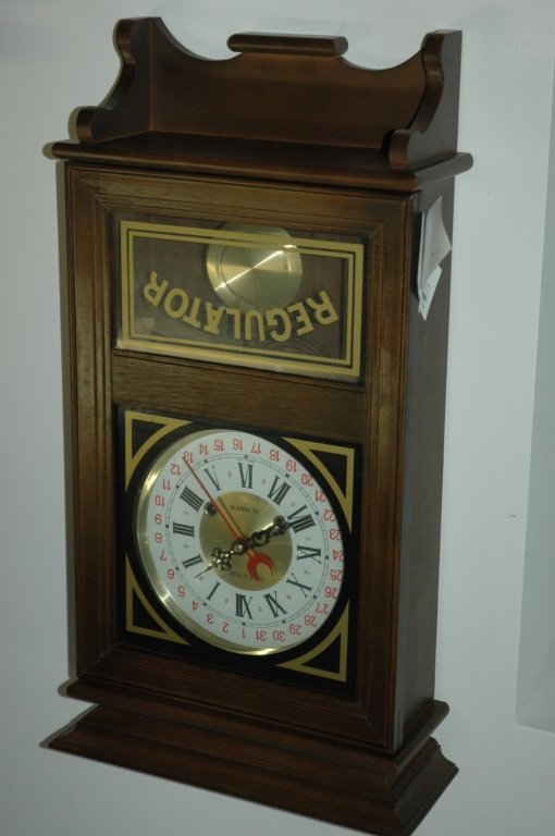 Necor "31 day" Clock: This clock has a day dial as well as numeric. App. Meas: 27"x13"x5"
