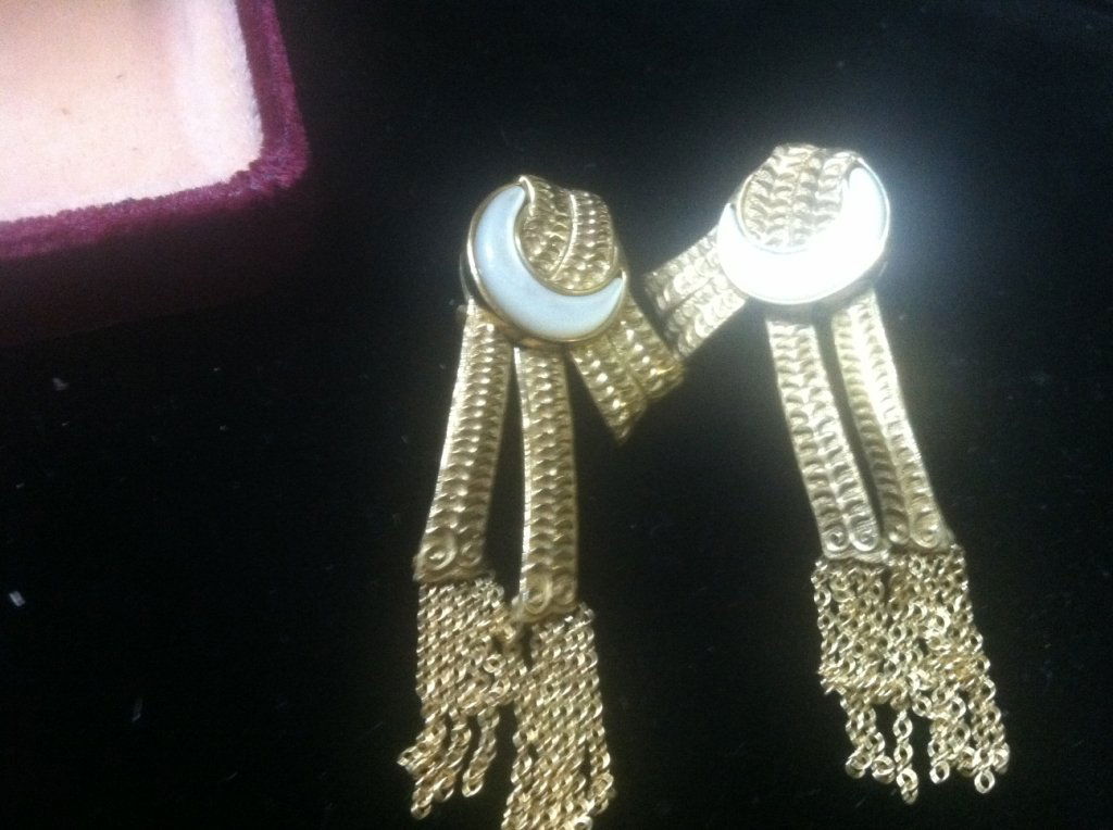 Sterling silver Earrings Signed "ERTE": A pair of sterling earrings designed by Erte, in the form of crescent moons with ribbon bands. Signed "Erte" and "Sterling, 6/500, CFA" (CFA is circle fine arts)