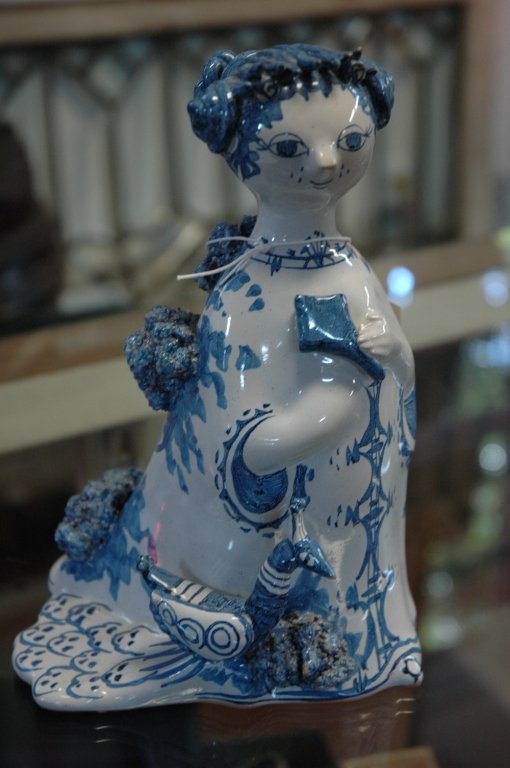 Bjorn Wiinbladt Sculpture: A blue and whit decorated statue of a women with a bird signed and dated " Mig 1968 " (approx 8" x 6 ")