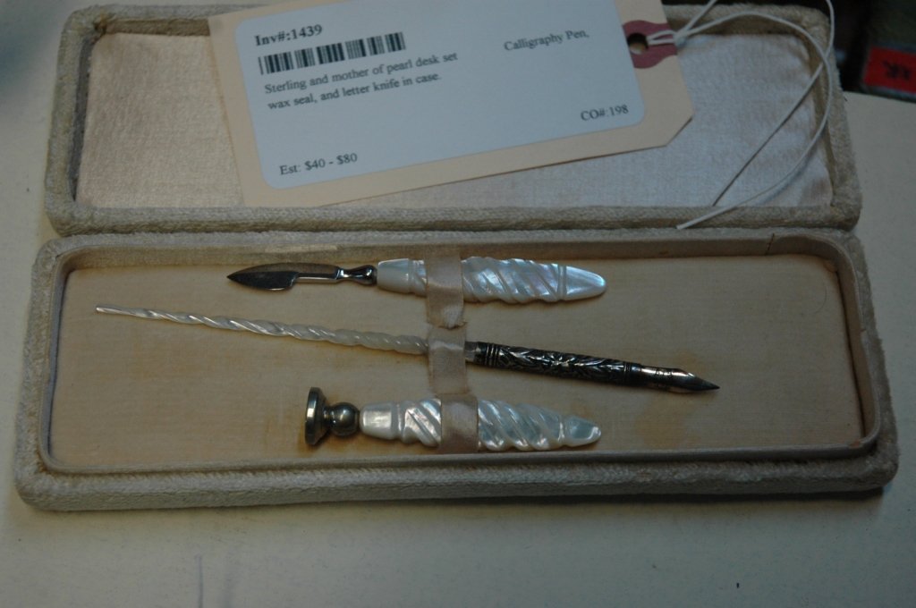 Sterling and mother of pearl desk set: Calligraphy Pen, wax seal, and letter knife in case.