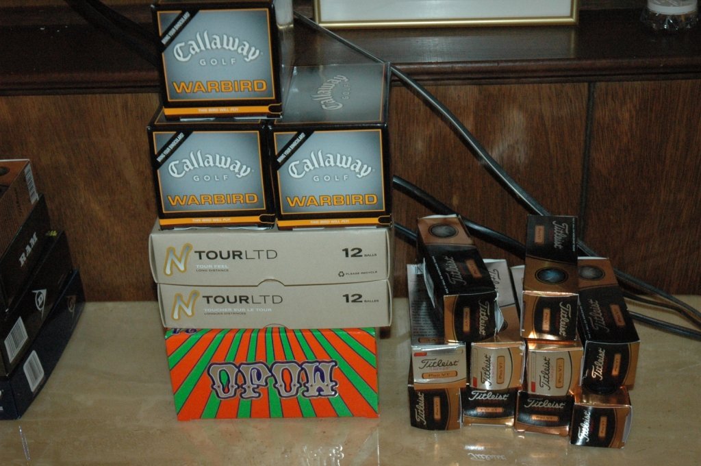 102 new golf balls: Mojo, End Tour, Callaway , and Titleist.