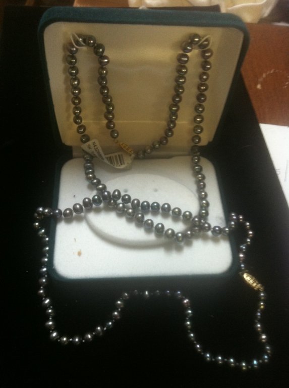 2 Tahitian style strands of Pearls: 2 Strands of Tahitian style pearls with 14kt yellow gold clasps. One with original 119.99 price tag