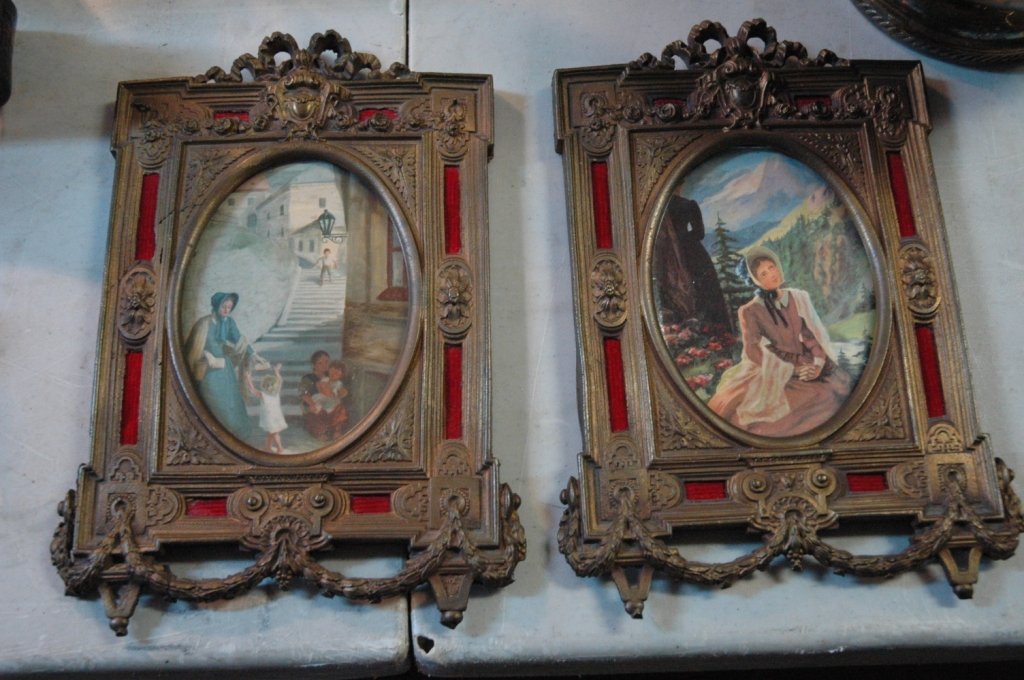 Pair of brass picture frames: 10.5 x 7.25 very heavy with original print for display