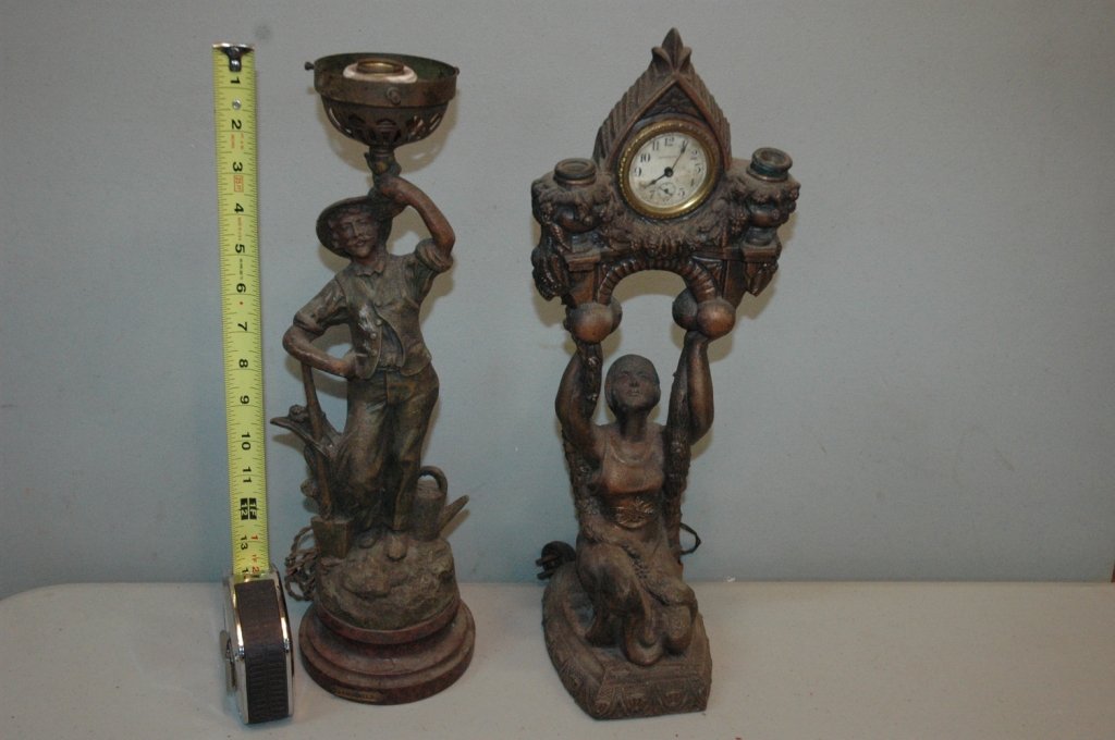 Antique White Metal lamps: A women kneeling hold up a " Waterbury " Clock with the ability for 2 bulbs. 18" tall with original cord. With A Minor holding a torch, missing the original globe or up light. Standing 16.5" tall.