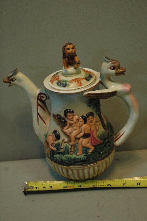 R. Capodimonte teapot: With a Lion lid and bird handle and spout. Featuring children playing with their horse's