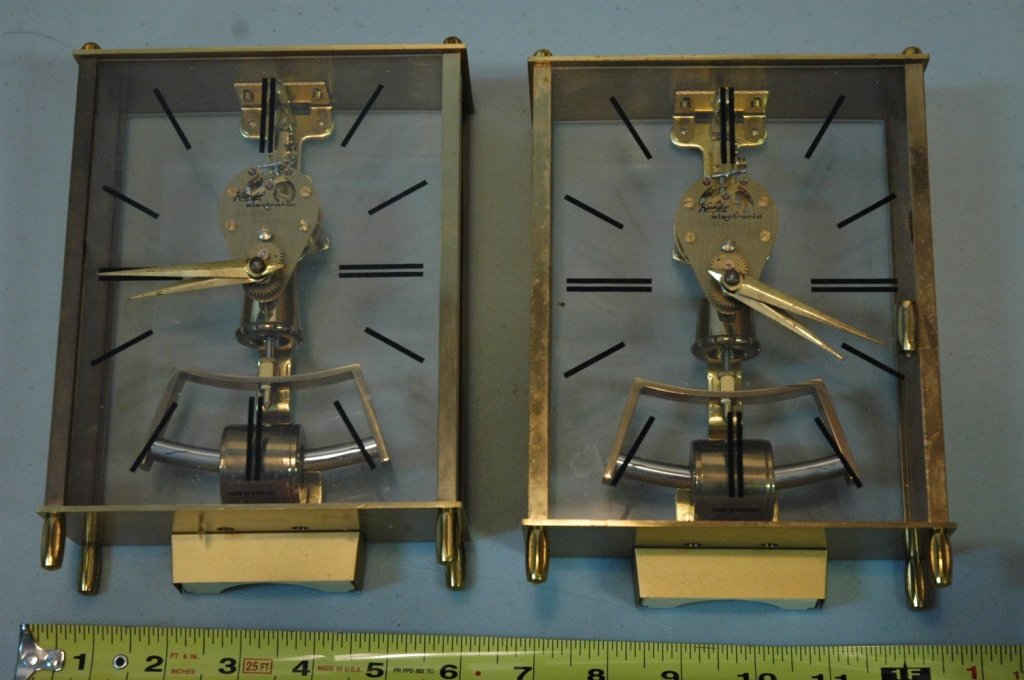 pair of Kundo Electromagnetic Clock: Made in Germany, approx 5 1/4" wide x 8 1/2" tall AS IS one is missing a leg.