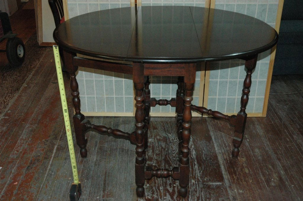 Antique drop leaf table: 34" X 13" closed, 42" X 34"X 30" tall.
