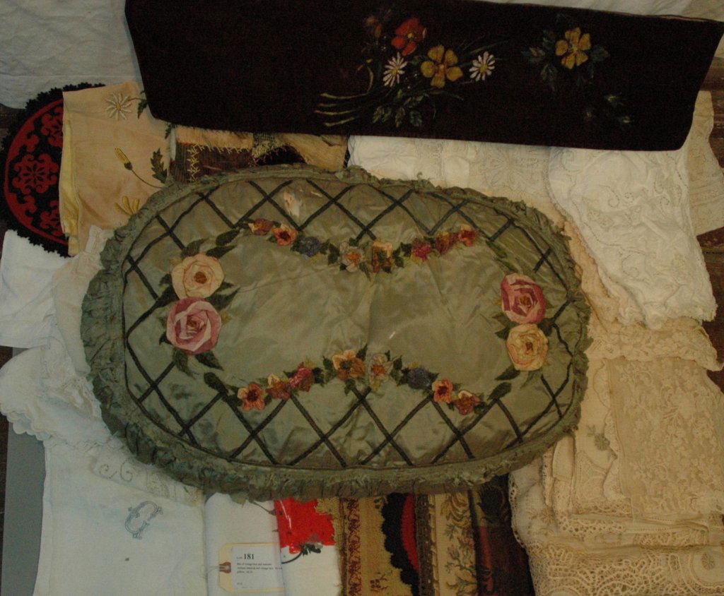Bin of vintage lace and material: Antique material and vintage lace. As well, there is an antique pilllow. AS IS