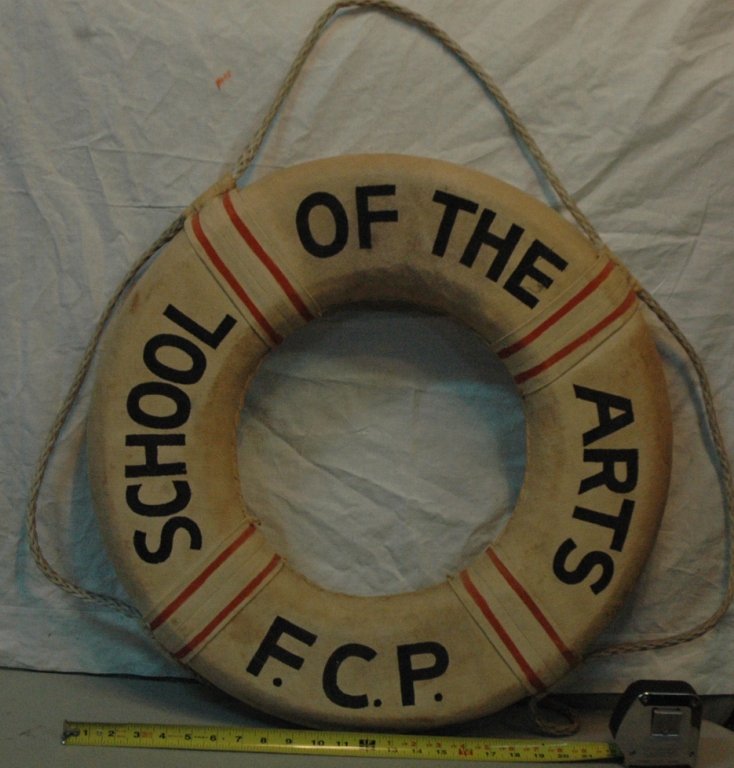 Painted Life Preserver: A life preserver with the legend "School Of The Arts F.C.P." painted on the canvas