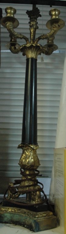 A Pair of Ebony & Brass lamps: A pair of ebony and brass table lamps. 37" tall, with "Warren Kessler" tags.