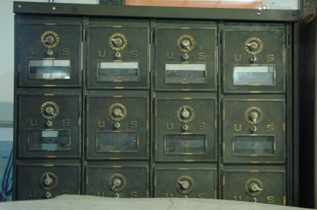 A bank of 28 Post Office boxes: A bank of Post Office boxes, 7 boxes tall x 4 boxes wide. 46" tall x 24.5" wide x 12.25" deep.