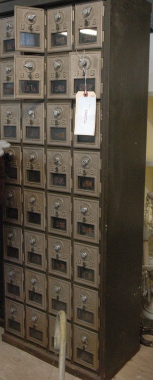 A bank of 32 Post Office Boxes: a bank of Post Office boxes, 8 tall x 4 wide. 48" tall x 17.5" wide x 11" deep.