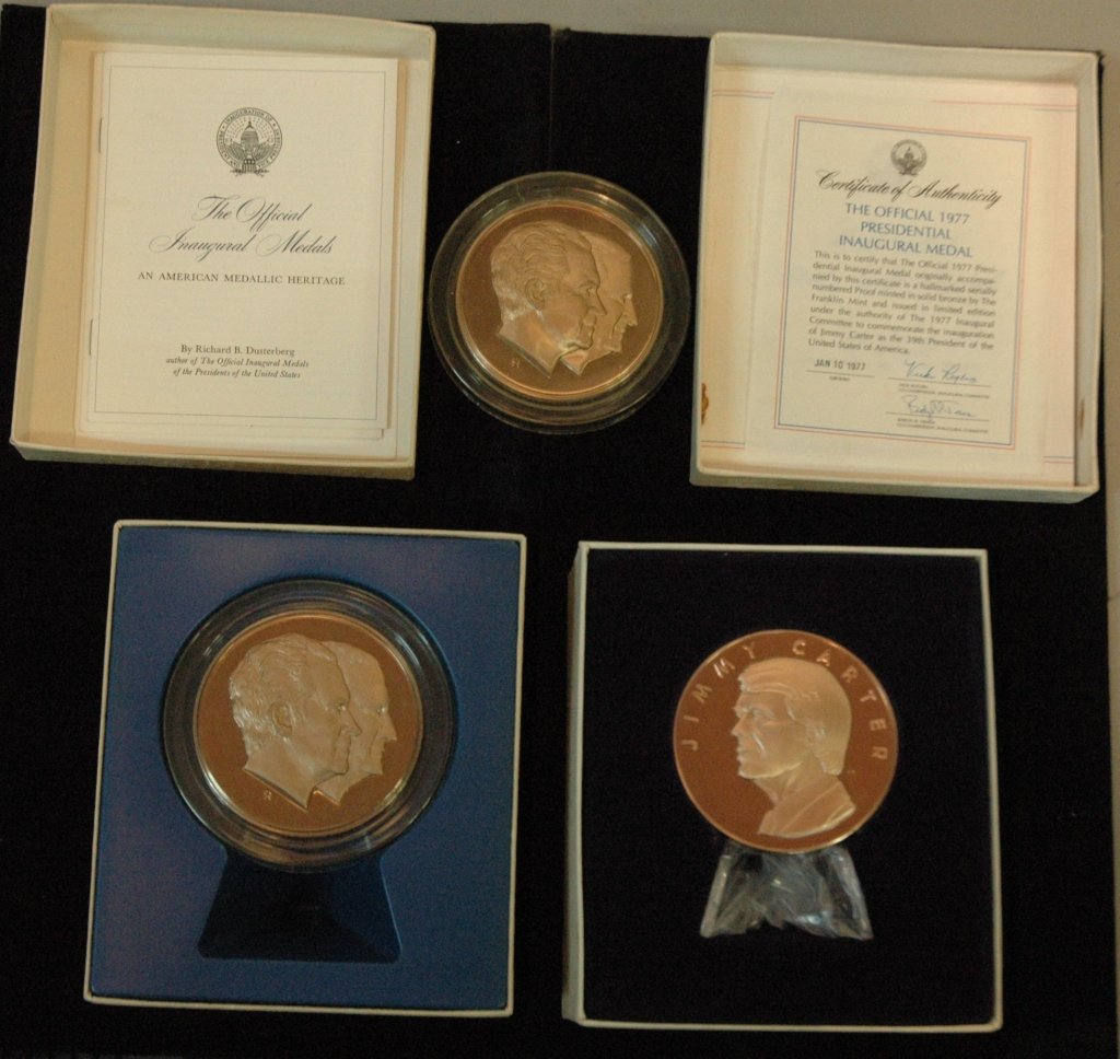 Presidential Inaugural Medals: President Jimmy Carter in the box with papers, and 2 President Richard Nixon & Vice President Spiro Agnew (1 of these is in the box with paperwork) .