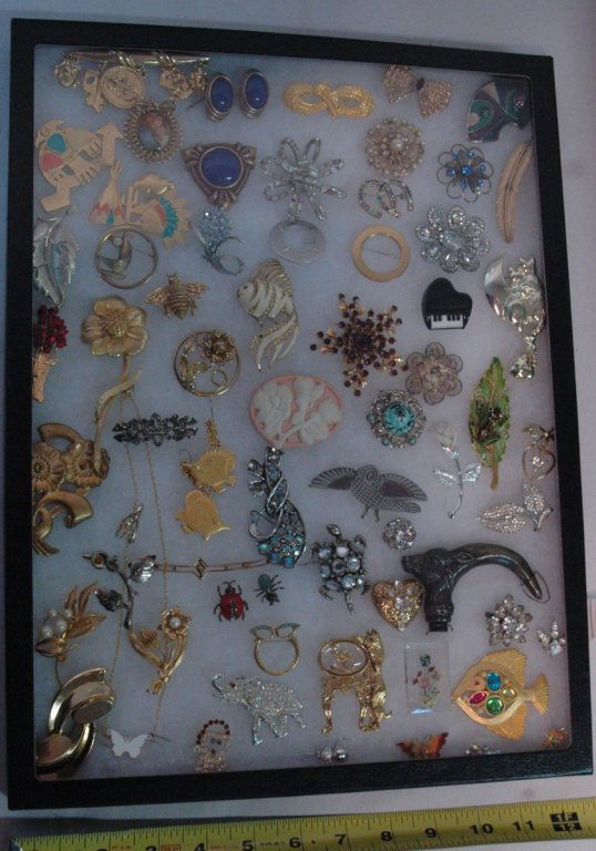Vintage Trifari, Monet, Avon, Gold filled,& more..: Mostly designer costume pins, mixed in with a few other pieces. Including the antique head of a walking cane, a frog pin signed by "Robert"??