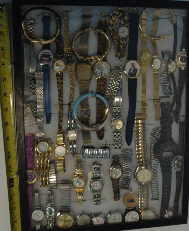 Mixed watch lot, Pierre Cardin, Timex, &.......: Pierre Cardin, Gold Watch Cuff Vintage Hinge Bracelet Brand Quintel V-148 , Timex, Quartz, Pulsar, Winston Racing, vintage Camel watch, Smurf Watch, and more . Over 25 watches AS IS, with 7 watch face