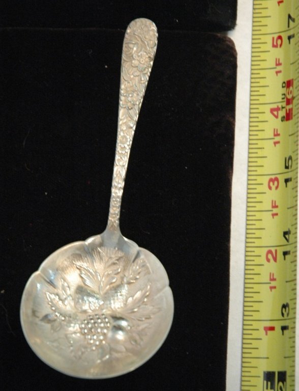 A Sterling silver S. Kirk & Son berry spoon: A sterling silver S. Kirk & Sons sterling silver berry spoon, appx. 5", in a repousse pattern.