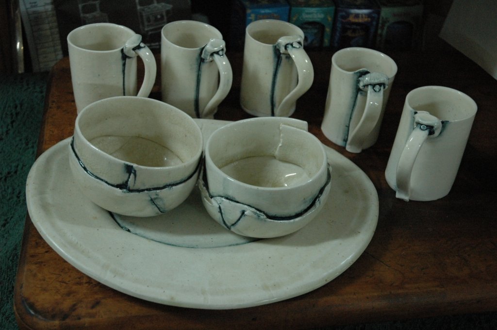 hand Made Signed Pottery Serving set with cups: Two Serving Bowls Plus one large Platter. With 5 cups. All hand made by artist. Illegibly signed on the bottom of each piece.