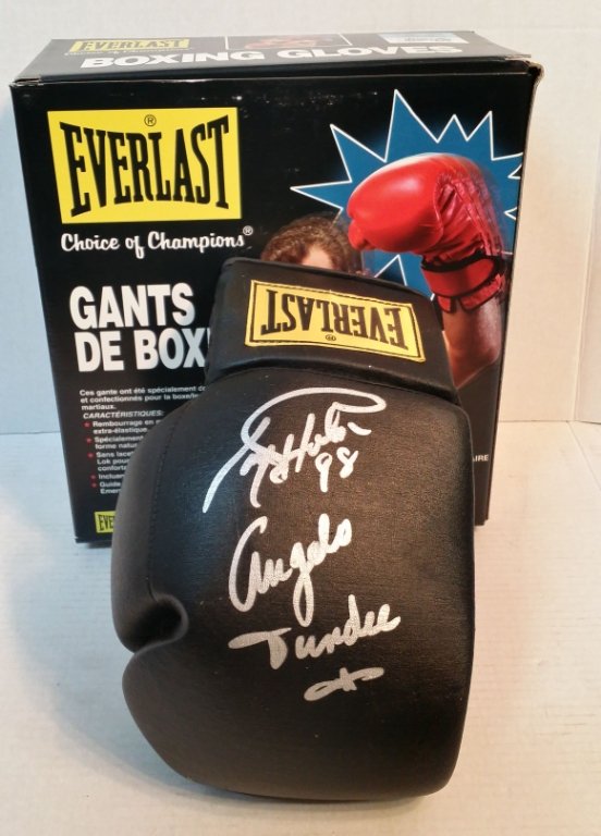 Angelo Dundee & Larry Holmes autographed glove: Autographed in 1998 by the recently pass great trainer Angelo Dundee and Legendary boxer Larry Holmes.
