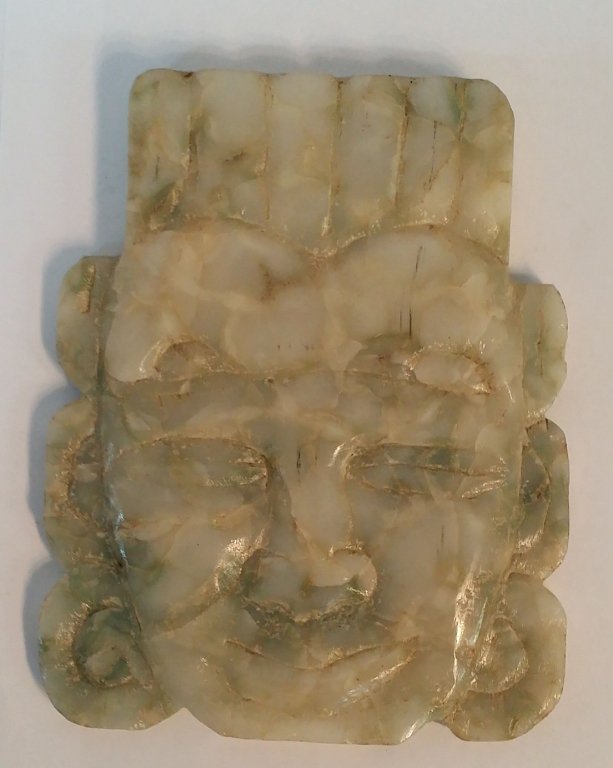 Carved Mayan Stone Mask: Hand carved Mayan stone mask mounted on Asian inspired frame.