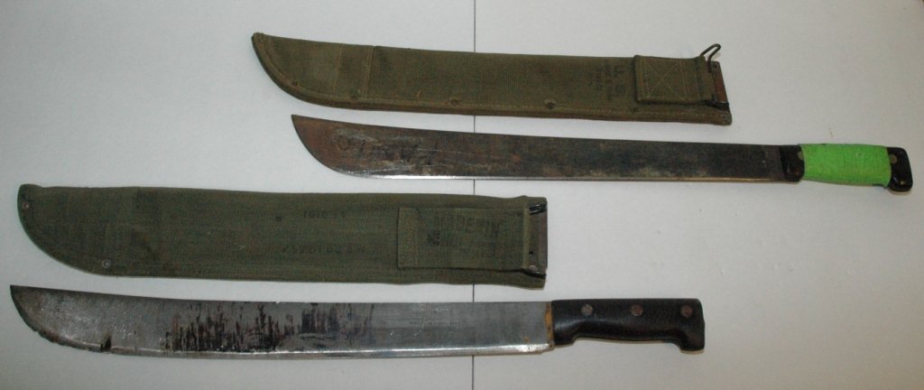 U.S. Issue Herkert & Meisel Trunk Co. Machete 1945: Along with another Machete. Both made in England, with canvas scabbards. AS IS