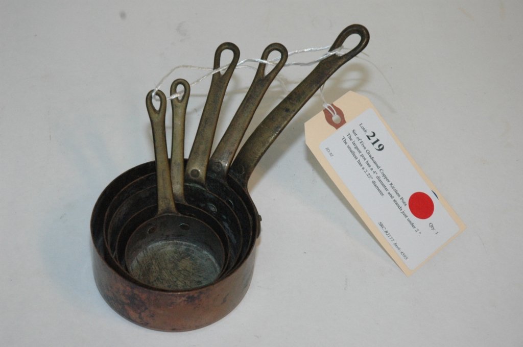 Set of Five Graduated Copper Kitchen Pots: The largest pot has a 4" diameter and stands just under 2 ". The smallest has a 2.25" diameter.