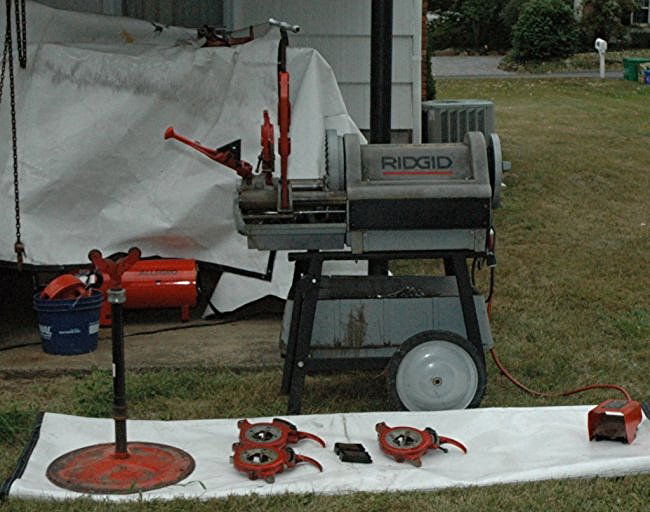 LIKE NEW Rigid 1224 Pipe Threader, Stand, Staorage: Package retails over 11,000 Adjustable pipe stand/roller, extra storage case, 4 dies, reamer, and the pipe cutter and more