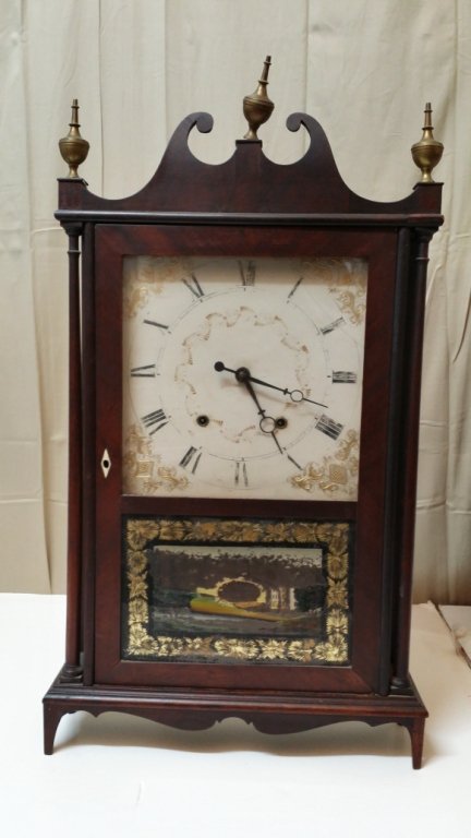 An Antique Samuel Terry Clock: A Samuel Terry clock, labeled "Patent Clocks/ Invented by/ Eli Terry/ Made and sold at Plymouth, Connecticut/ by/ Samuel Terry". The glass decorated door as is, dial with fading, glass cracked.