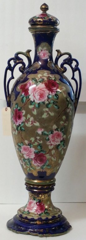 An Antique Monumental Nippon Floor Vase: A truly monumental, oversized Nippon painted vase. Painted roses, gilding and Moriage decoration. With blue leaf mark from the 1891 era. 37.5" tall overall (!). Appx. 33.5" to rim. Largest side to sid
