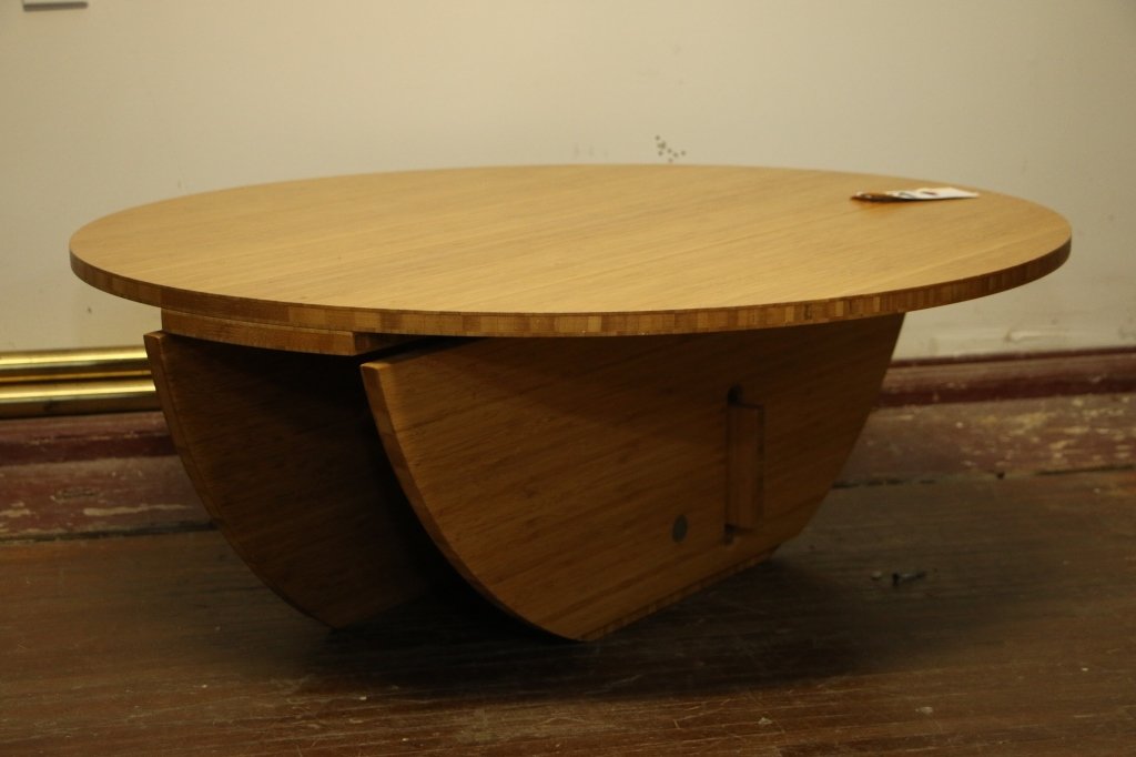 Modern Round Coffee Table, Unique Puzzle Legs: Legs Fold Flat, they lock together in a puzzle style when opened. 13.75" X 36" diameter. Less the 2" when closed.