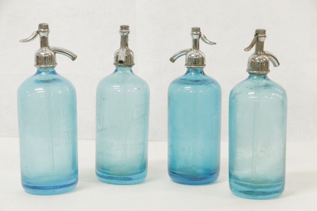 Collection of Blue Glass Antique Soda Bottles: Ridgefield Park B. Co., Chateau Bottling Co., Sparkling Beverage Co., and Jamaica Seltzer Inc.