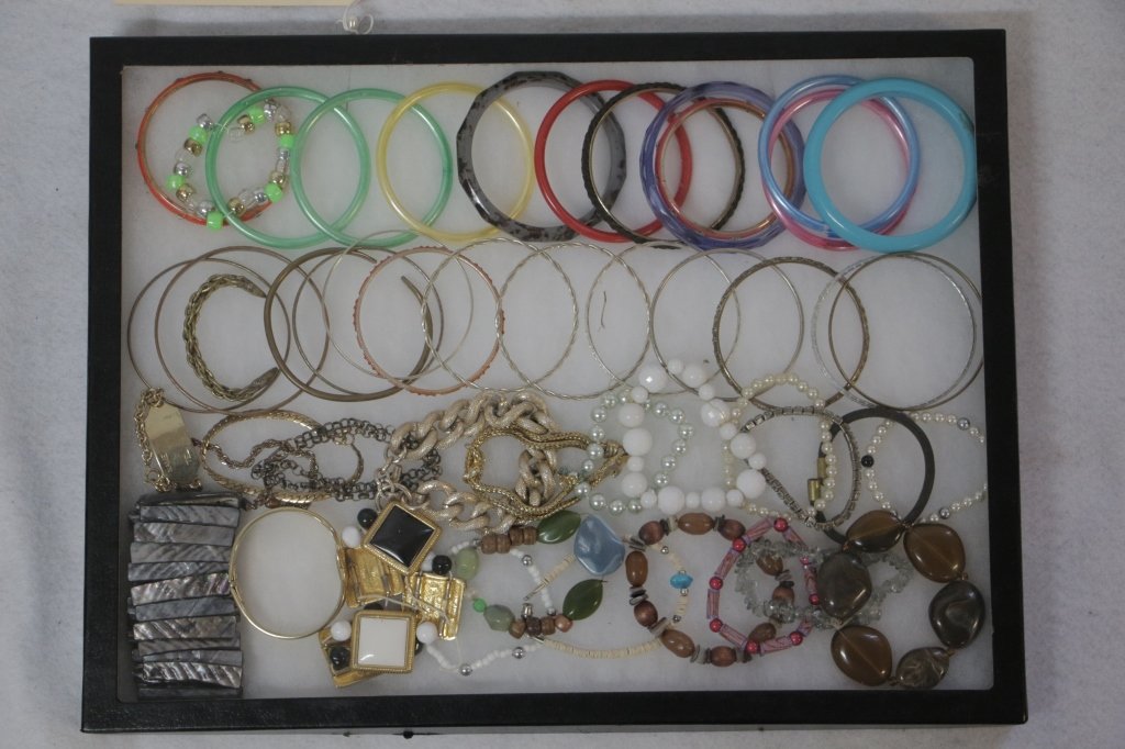 Bracelets: Large assortment of bracelets. Plastic, beaded, shelled