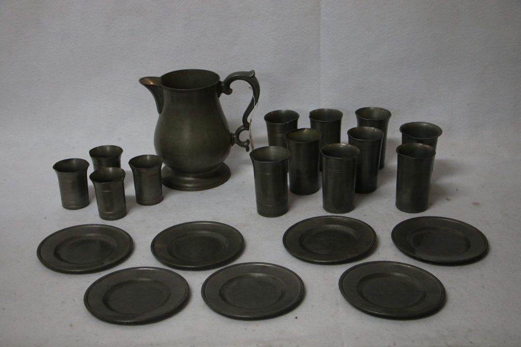Antique Assorted Poole Pewter, Taunton Mass: A large pitcher 8.5", 7 plates, and 13 cups. Most are Poole Pewter.