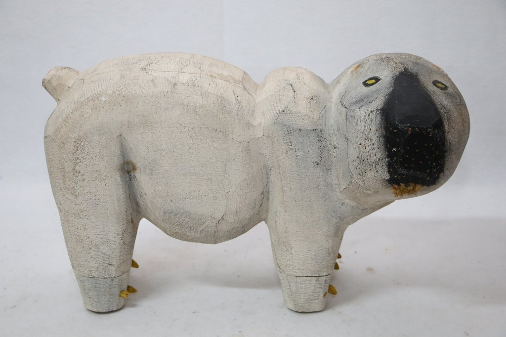 A Large carved wooden Polar Bear sculpture: A folk Art carved polar bear. Appx 24" head to tail, 14.5" head to tail. Signed in pencil on base, maybe "Ron Felt/ 1988/ White Polar Bear". Some minor losses. A great object.