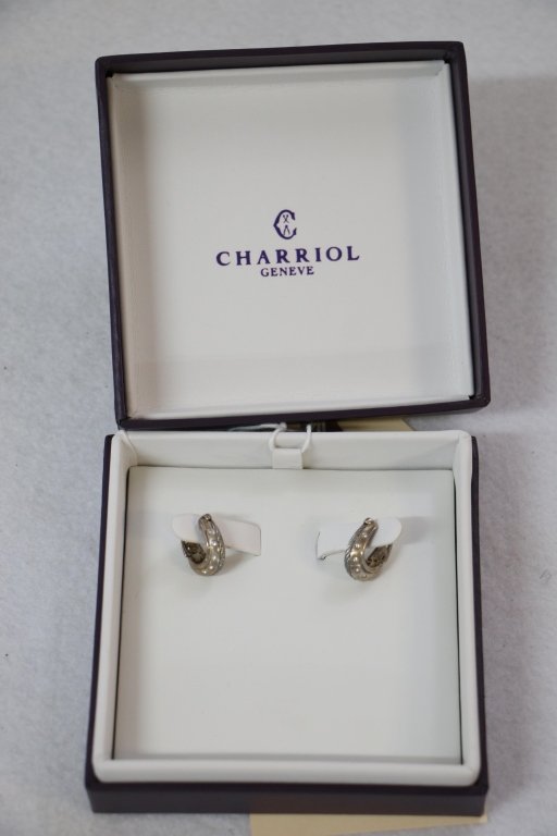 A Pair of Sterling Silver Charriol earrings in box: A pair of Charriol sterling silver earrings. Cable and diamond design. In original box.
