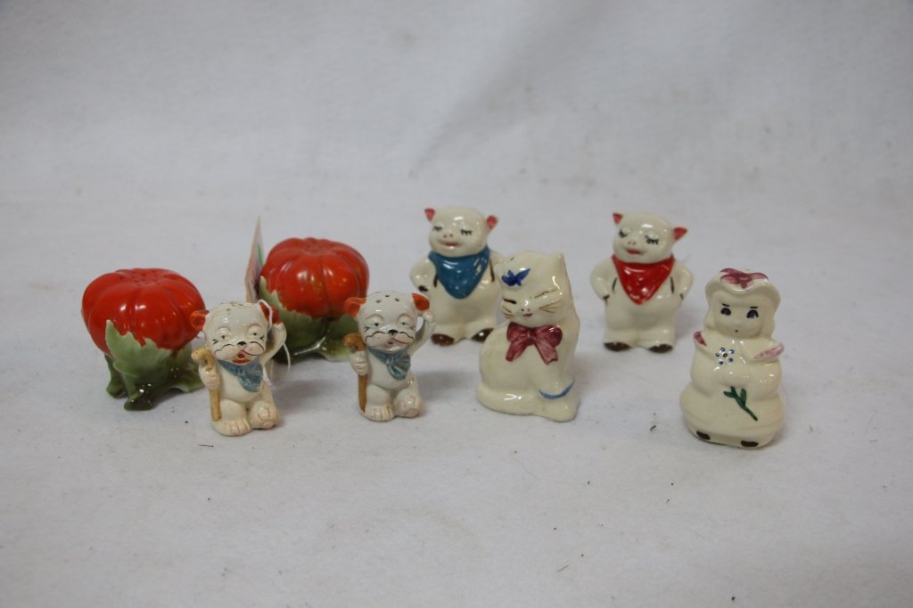 Salt & Pepper Lot: A pair of Shawnee pottery pigs, a Shawnee Bo Peep, A shawnee Puss N Boots, a pair of tomato shakers, and a "Salt" and "Pep" character set.