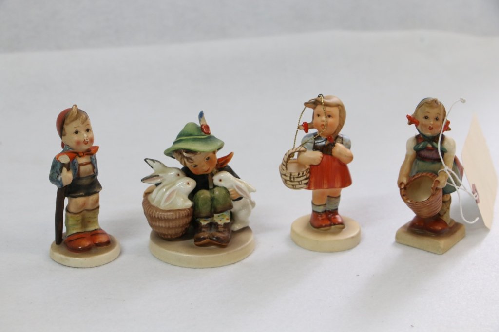 Group of 4 Hummel Figurines: Boy with rabbits (head repaired), girl with basket (1984 Schmidt), Girl with basket (head repaired), Boy with staff (as is).