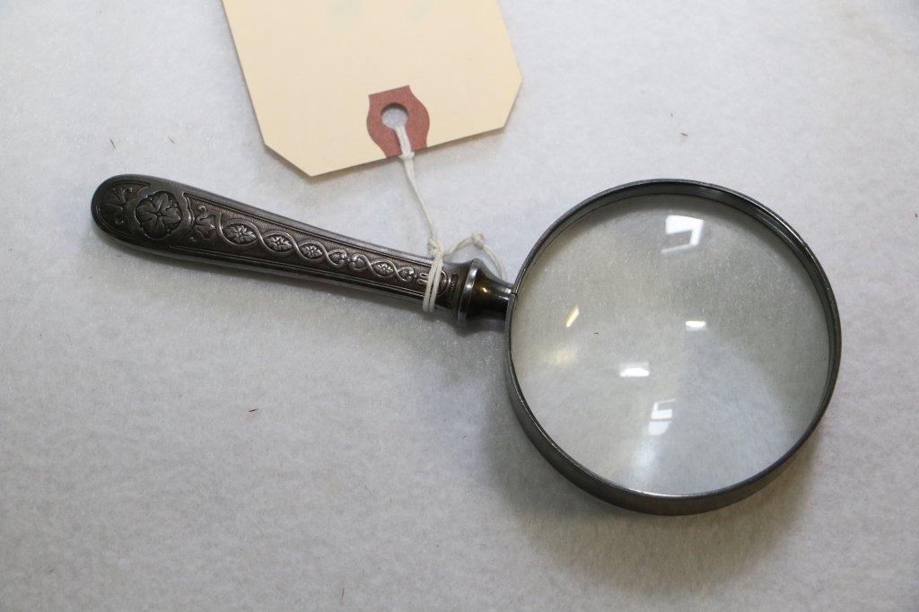 Antique Christofle Magnifying Glass: The handle signed Christofle. Glass with fine magnification. 6 5/8" long, glass 2 7/8" wide.