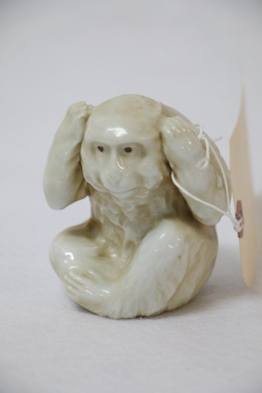 A fine quality antique Capo Di Monte Monkey: The white glazed monkey in the "hear no evil" pose. Appx. 3.25" tall. Crowned "N" mark visible on base.