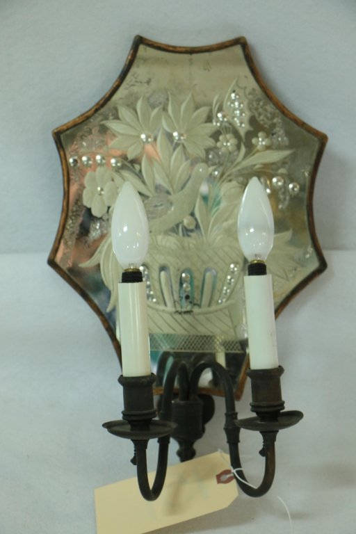 Antique mirrored back etched sconce with bird.: The fine mirror back panel with bird and floral design (minor losses to silvering) no mounted as a 2 light sconce. Lighting arms as is. 15" h x 9.5" w.