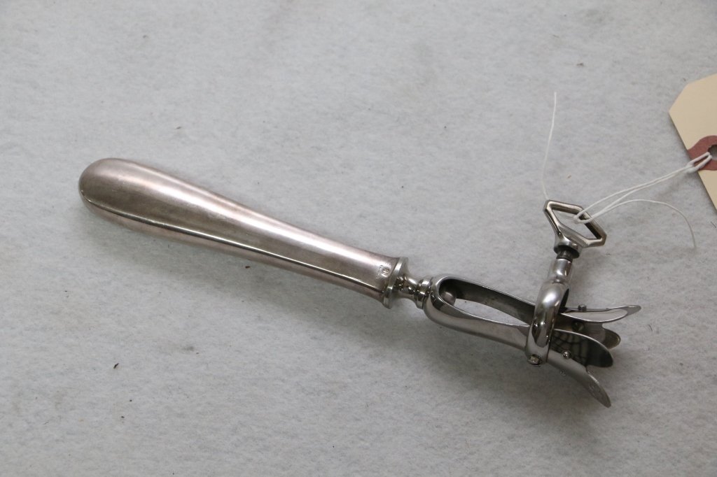 A Christofle Silver Plate Shank or Bone Holder: The 8.25" long joint holder marked "France", with the "O (Chess Knight) C" mark. A vintage, usable Gigot D'agneau.