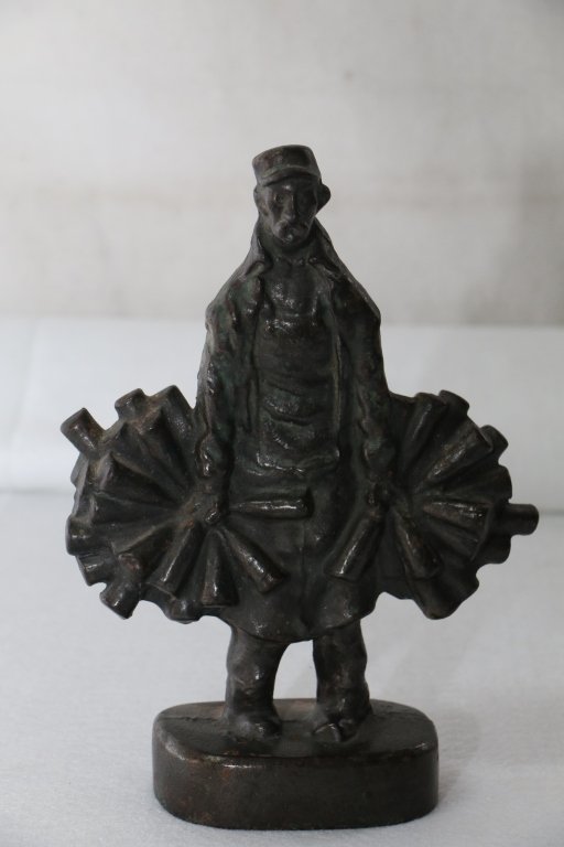 Cast Iron Wine Merchant Doorstop: Shows Wine Man wearing apron and holding bottles of wine in left and right hands. Well executed casting, full-figure, solid casting. Rare and Desirable. Standing 9 3/4", as found