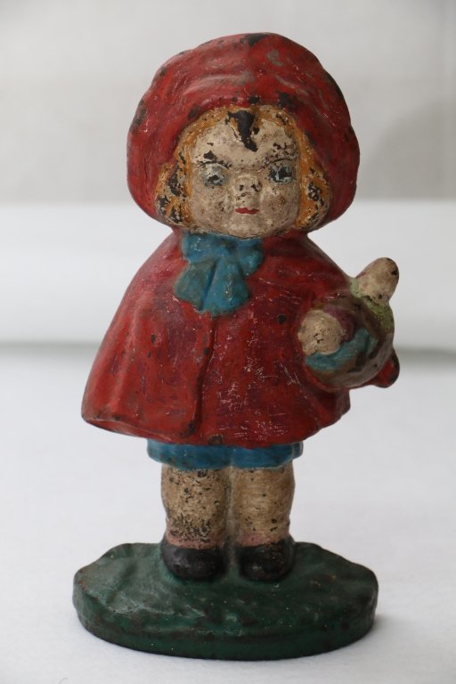 3Little Red Riding Hood Doorstop: Hubley, design by Grace Drayton, depicts bright eyed rendition of Red Riding Hood in familiar red cape with basket of goodies. 9 1/2" x 5". With minimal paint loss