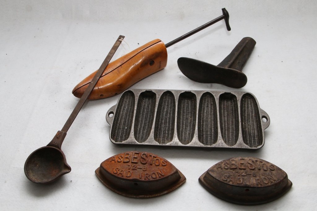 Vintage Metal Lot: Wagner Ware corn pan, casting ladle, (2) Asbestoes "Sad-Iron", and shoe maker tools.