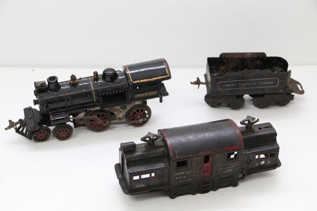 Antique Toy Train Ives Lot: Ives Railway Line Motor (no undercarrige) #3238 in red and black paint, a "Limited Vestiblue Express" coal tender, and an Ives No. 1125 Engine, black pint, red and gold highlights.