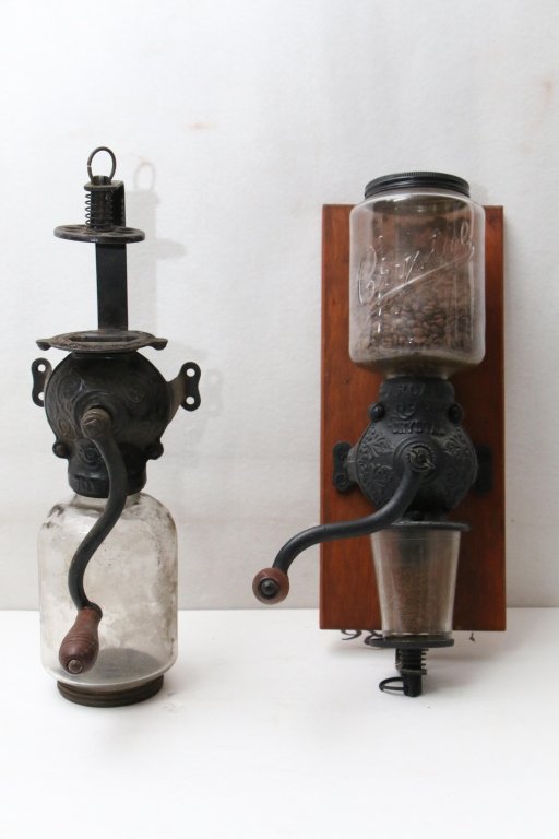 2 Arcade Crystal Coffee Grinders: Excellent working condition with antique coffee beans!!! approximate 18". Along with other missing catch glass.