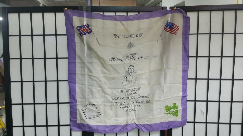 Antique silk souvenir handkerchief, Boxing: 19th C. souvenir. "National Contest/ Middleweight Championship/ Of England/ Between/ Jack O'Brien, America/ Charley McKeever/ Jany 27th, 1902/ L630". Bout won by O'Brien by a foul in 3 rounds. Appx. 2