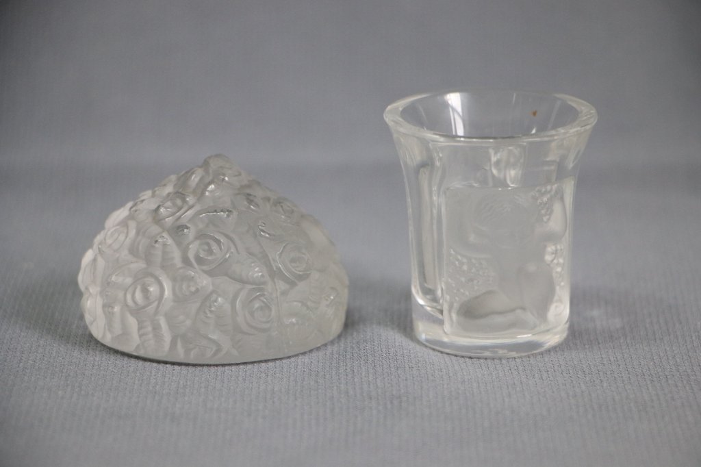 Lalique France Sot Glass and Paperweight: The shot glass 1 7/8" tall,with cherubs. The paperweight appx, 2 1/8", looks like a bouquet of flowers.