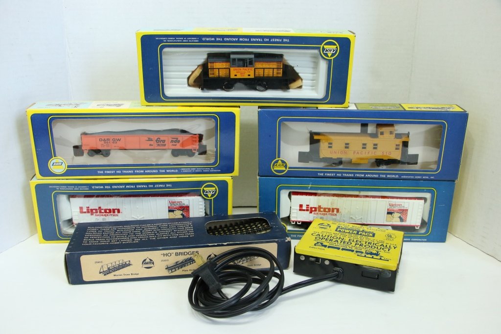 A.H.M. HO Scale Model Railroad Cars & Power Pack: Engine, 4 cars, and track in original boxes.